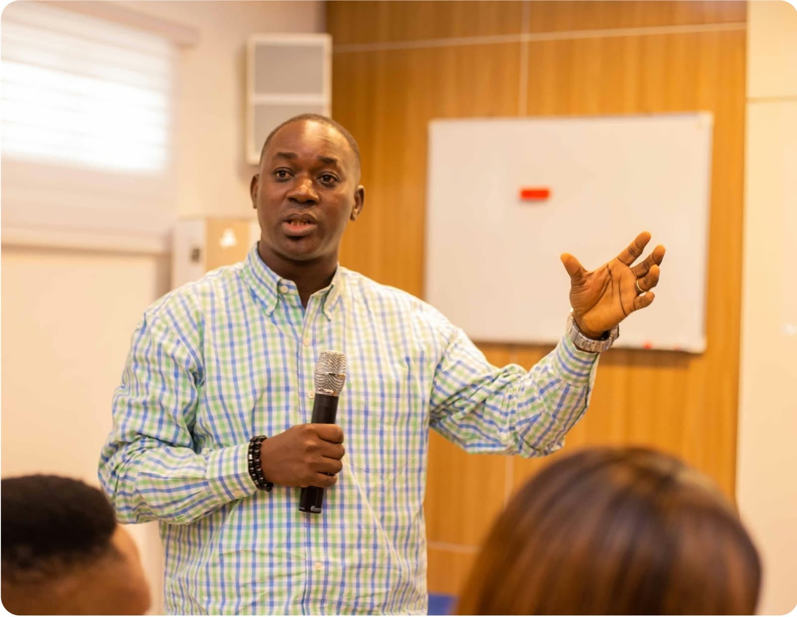 A mentor addressing a small audience